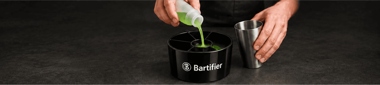 A measured green ingredient being poured from Bartifier