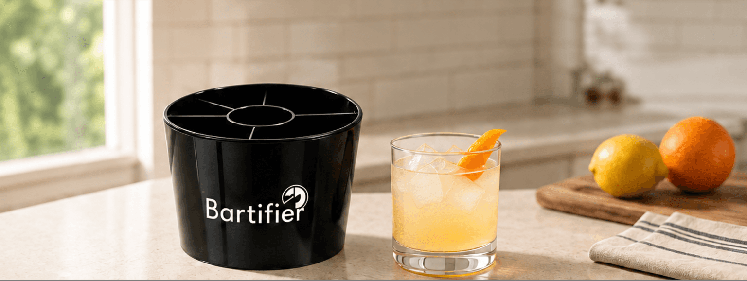 Bartifier, a phone and a finished cocktail on a home counter